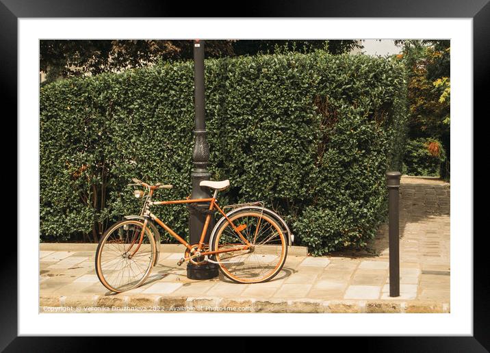 Old bicycle on the street  Framed Mounted Print by Veronika Druzhnieva