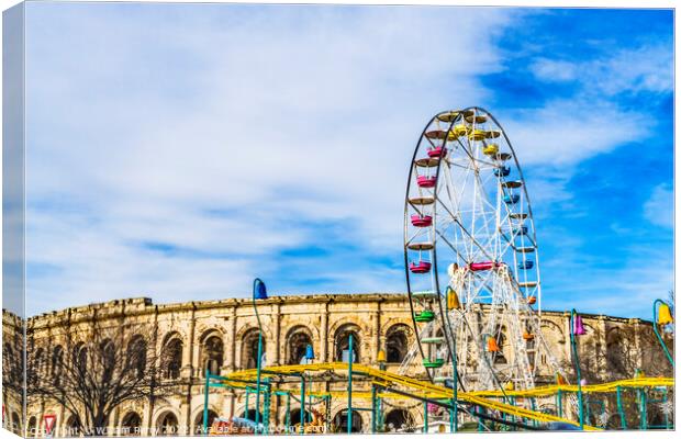 Christmas Amusement Rides  Roman Arena Amphitheatre Nimes Gard F Canvas Print by William Perry