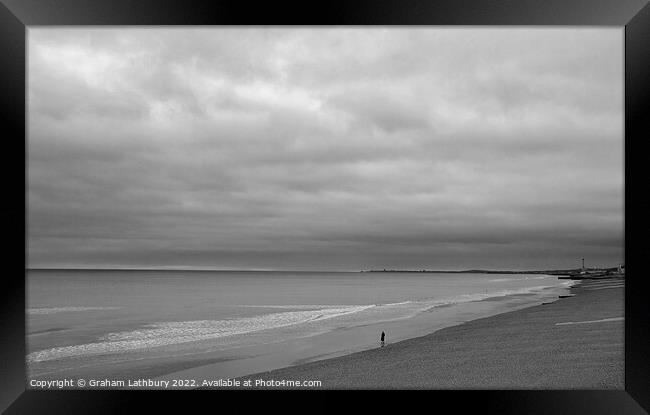 Lone Walker on Brighton Beach Framed Print by Graham Lathbury