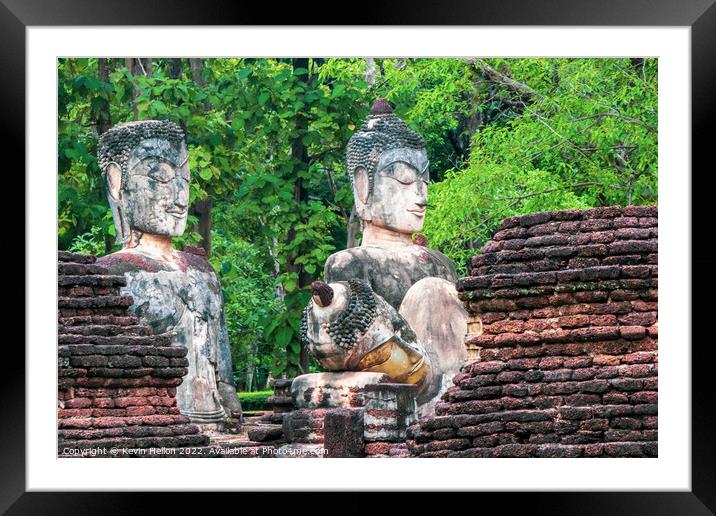 Buddha statues in Khamphaeng Phet Historical Park, Thailand Framed Mounted Print by Kevin Hellon