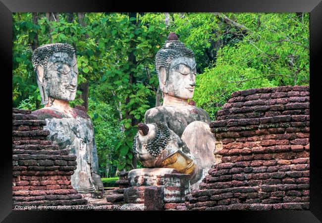 Buddha statues in Khamphaeng Phet Historical Park, Thailand Framed Print by Kevin Hellon