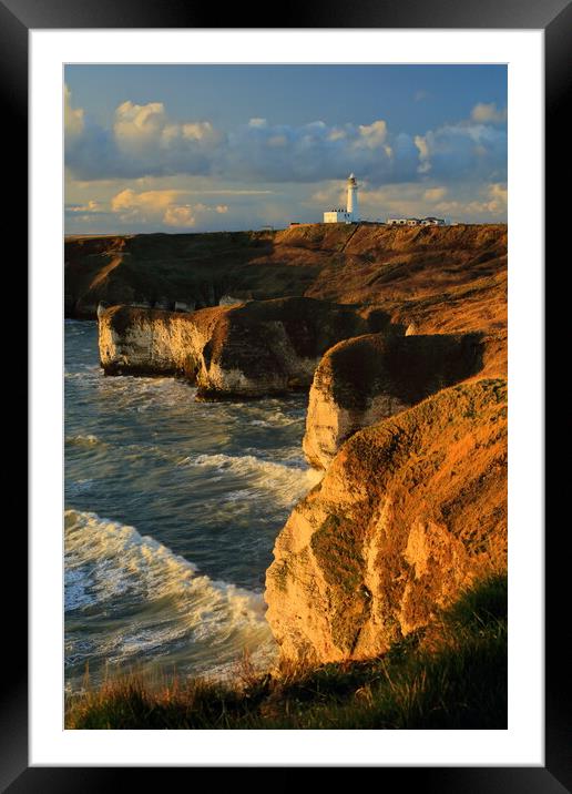Flamborough lighthouse and cliffs at sunrise. Framed Mounted Print by Drew Watson