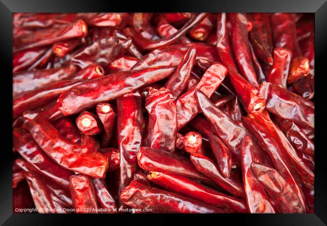 Shiny red dried chillies for sale on a market stall in Seoul, South Korea  Framed Print by Gordon Dixon