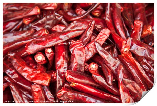 Shiny red dried chillies for sale on a market stall in Seoul, South Korea  Print by Gordon Dixon
