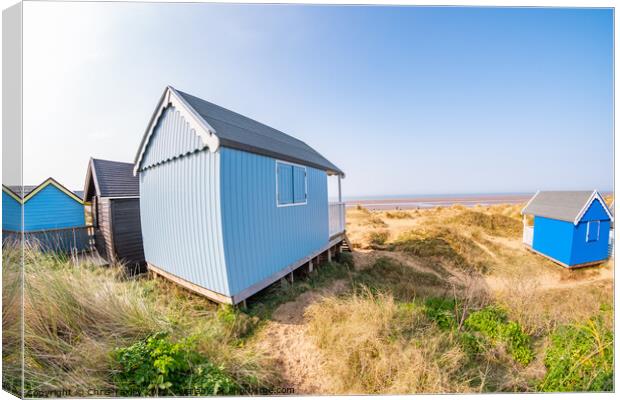 Coastal beach huts on the North Norfolk coast Canvas Print by Chris Yaxley