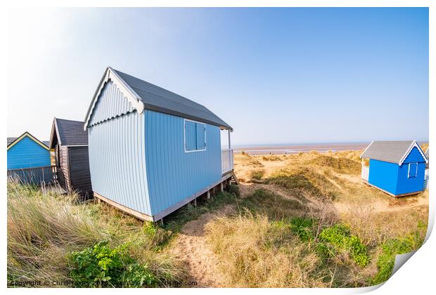 Coastal beach huts on the North Norfolk coast Print by Chris Yaxley