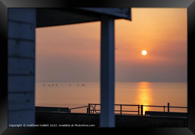 Sunrise Through Dovercourt Beach Huts Framed Print by matthew  mallett