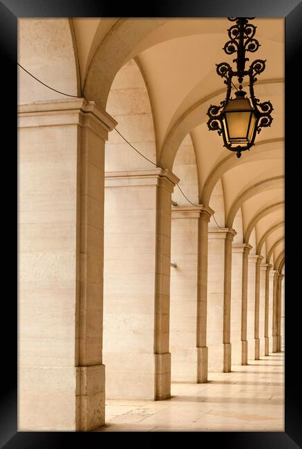 An arched walkway in Lisbon Framed Print by Leighton Collins