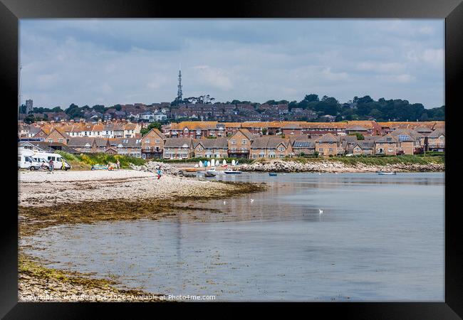 Chisel Beach Dorset reflection of the town in the water  Framed Print by Holly Burgess