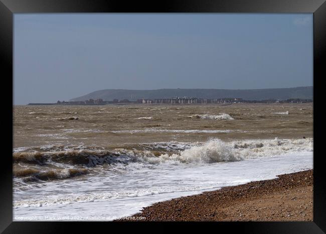 Eastbourne across the water from Pevensey Bay. Framed Print by Mark Ward