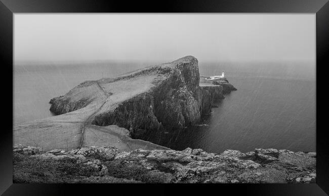 Neist Point Lighthouse in the snow  Framed Print by Anthony McGeever