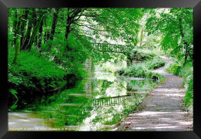 Reflections in a canal. Framed Print by john hill