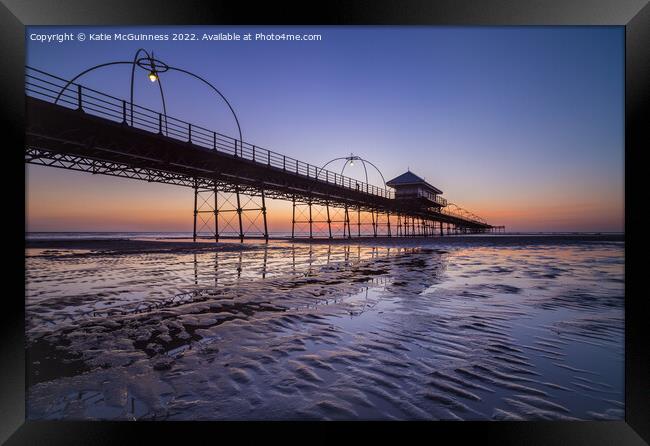 Sun setting behind Southport Pier, Merseyside Framed Print by Katie McGuinness