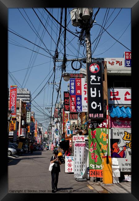 Colours and chaos of a Seoul backstreet Framed Print by Gordon Dixon