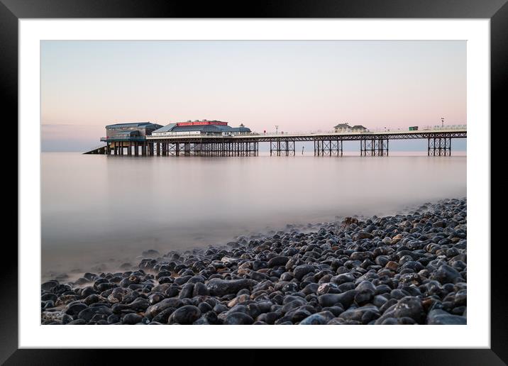 Cromer pier seen over the pebble beach Framed Mounted Print by Jason Wells