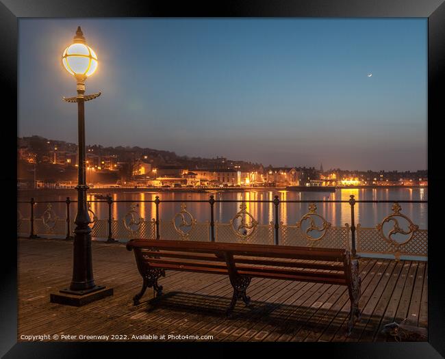 Illuminated Lamp Post And Benches On Swanage Pier Framed Print by Peter Greenway