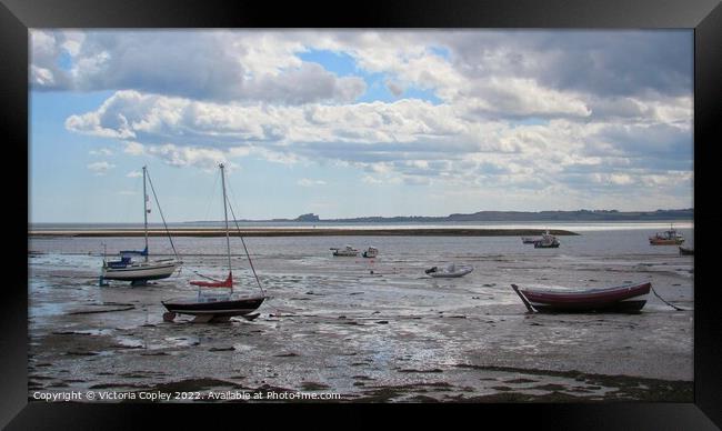 Lindisfarne boats Framed Print by Victoria Copley
