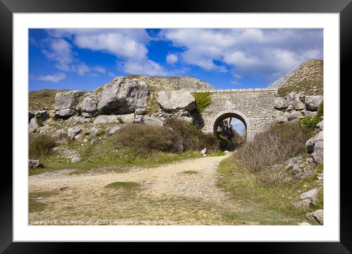 Stone archway at Portland Quarry Framed Mounted Print by Ann Biddlecombe