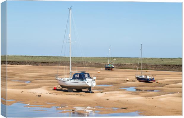 Trio of boats at Wells next the Sea Canvas Print by Jason Wells