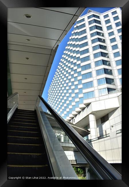 Escalator with building background Framed Print by Stan Lihai