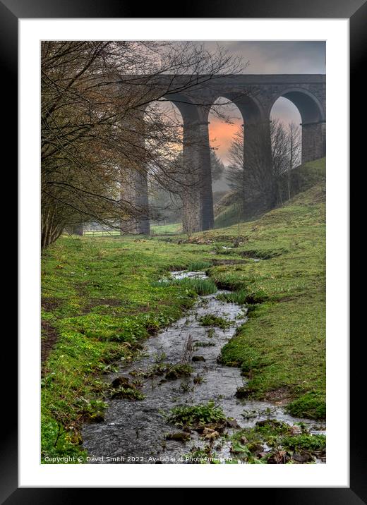 A viaduct over a body of water after heavy rain. Framed Mounted Print by David Smith