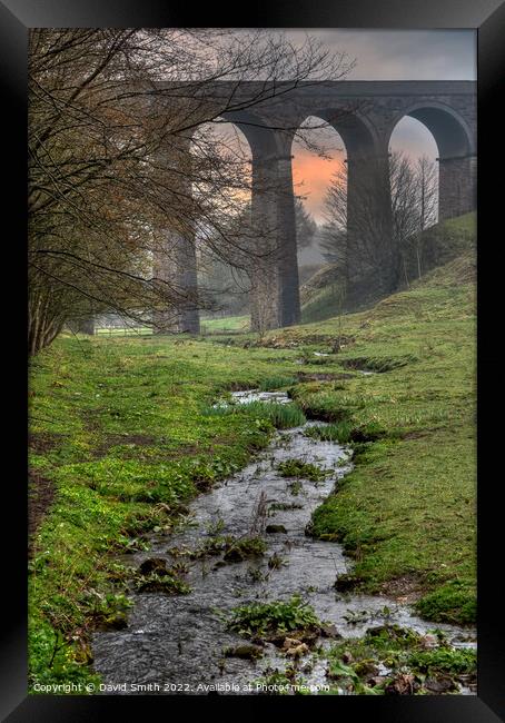 A viaduct over a body of water after heavy rain. Framed Print by David Smith