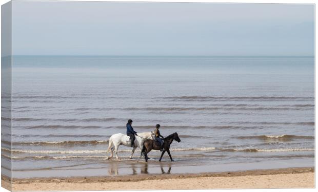 Horse riders on Formby beach Canvas Print by Jason Wells
