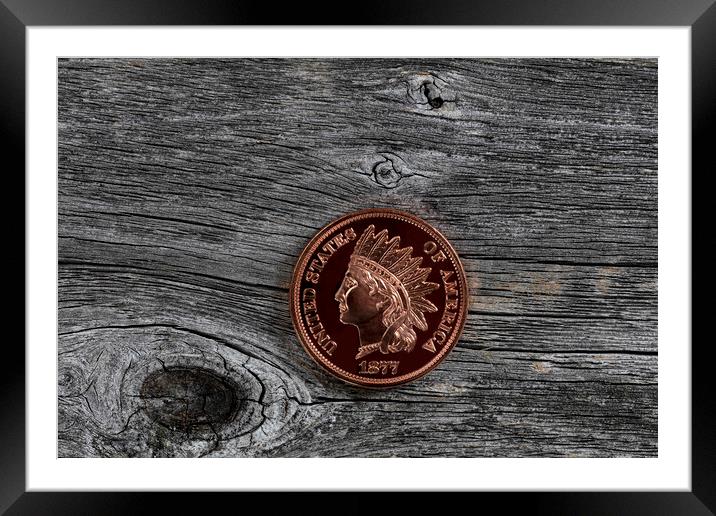 Single US Indian head one cent coin on rustic wood for numismati Framed Mounted Print by Thomas Baker