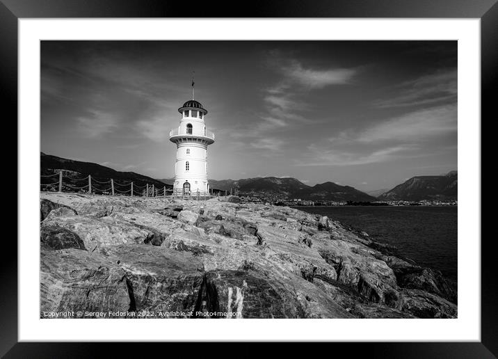 Old lighthouse in the port. Framed Mounted Print by Sergey Fedoskin
