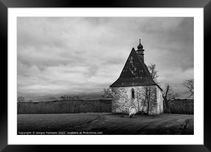 Old church in the field. Dobronice u Bechyne, Czechia Framed Mounted Print by Sergey Fedoskin