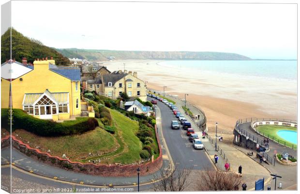Seafront and Brigg at Filey, North Yorkshire, UK. Canvas Print by john hill