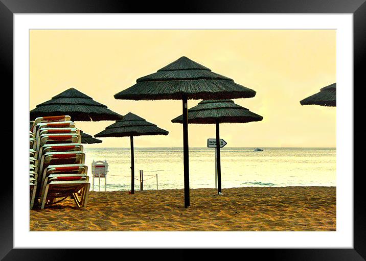 Sun set umbrellas on the beach in Portgual Framed Mounted Print by Tanya Hodgkiss
