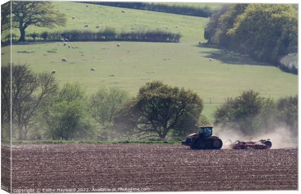 Working the land with machinery Canvas Print by Elaine Hayward