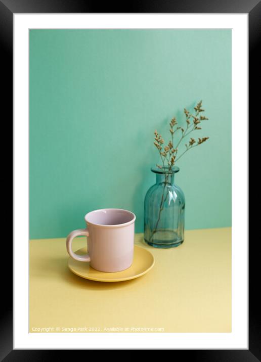 Coffee cup and dry flower Framed Mounted Print by Sanga Park