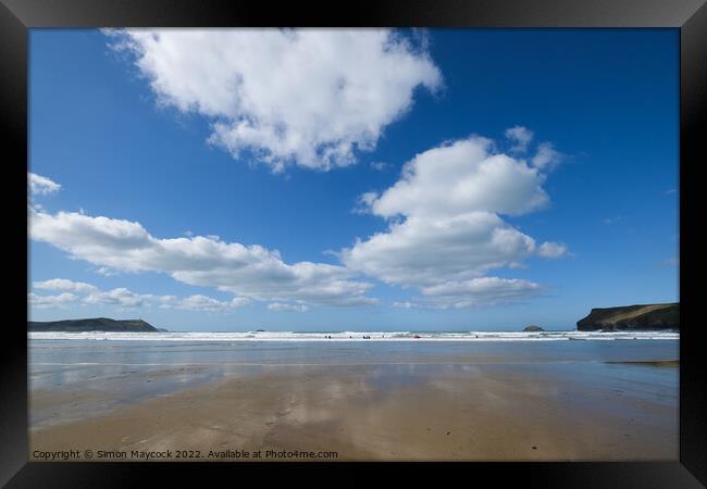 White clouds over Polzeath beach Framed Print by Simon Maycock