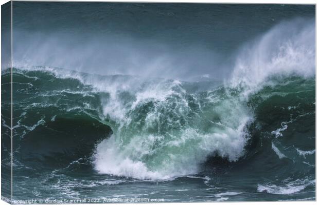A wild wave breaking on the Cribbar Reef off Towan Canvas Print by Gordon Scammell