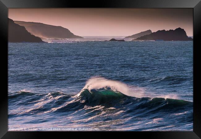 Evening light over a wave breaking in Fistral Bay  Framed Print by Gordon Scammell