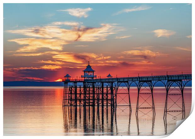 Clevedon Pier at sunset with colourful reflection on the sea Print by Rory Hailes