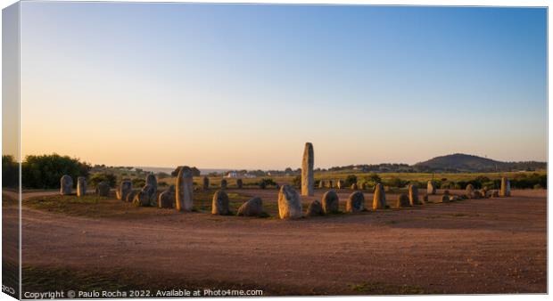 Stone menhirs at Cromeleque do Xerez in Portugal at sunrise Canvas Print by Paulo Rocha