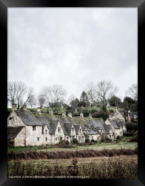 A View Of A Row of Historic Quintessential Cotswold Cottages In Bibury Framed Print by Peter Greenway