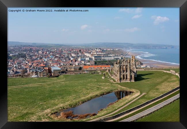 Whitby Abbey and town Framed Print by Graham Moore