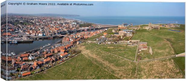 Whitby town harbour and Abbey headland Canvas Print by Graham Moore