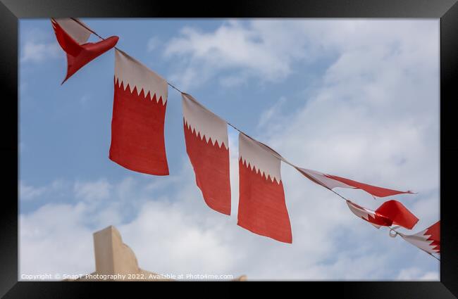 Al-Adaam national flags of Qatar flying in the sky above Doha, Qatar Framed Print by SnapT Photography