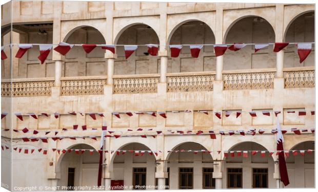 Rows of Al-Adaam national flags of Qatar flying in Souq Waqif, Doha, Qatar Canvas Print by SnapT Photography