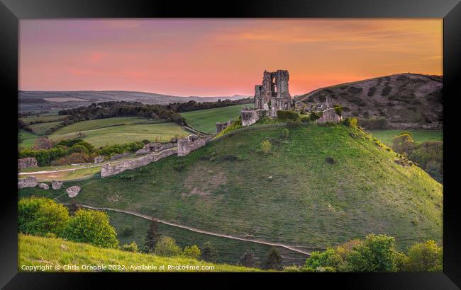 Corfe Castle at sunset Framed Print by Chris Drabble