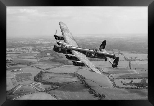 Lincolnshires Lancaster Bomber  Framed Print by J Biggadike