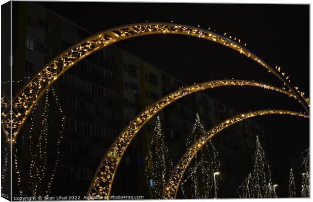 Illuminated arch in the park Canvas Print by Stan Lihai