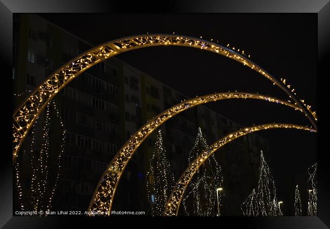 Illuminated arch in the park Framed Print by Stan Lihai