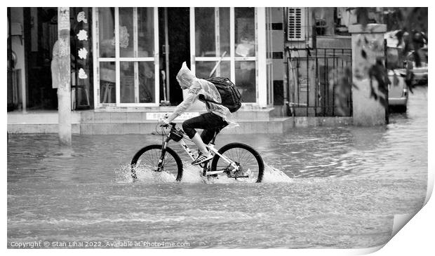 Person riding a bicycle under heavy rain Print by Stan Lihai
