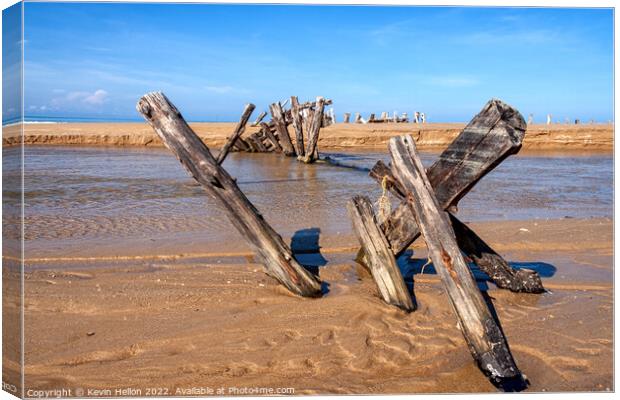 Posts in the sand Canvas Print by Kevin Hellon